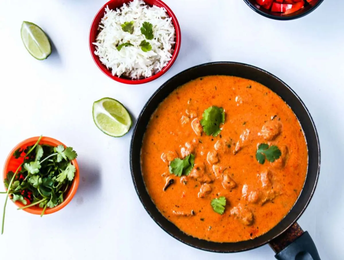 Chicken tikka masala with basmati rice and fresh cilantro